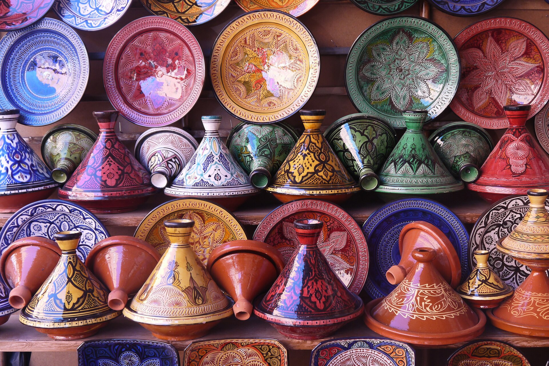 Tagines on display in a Moroccan pottery and ingredient market