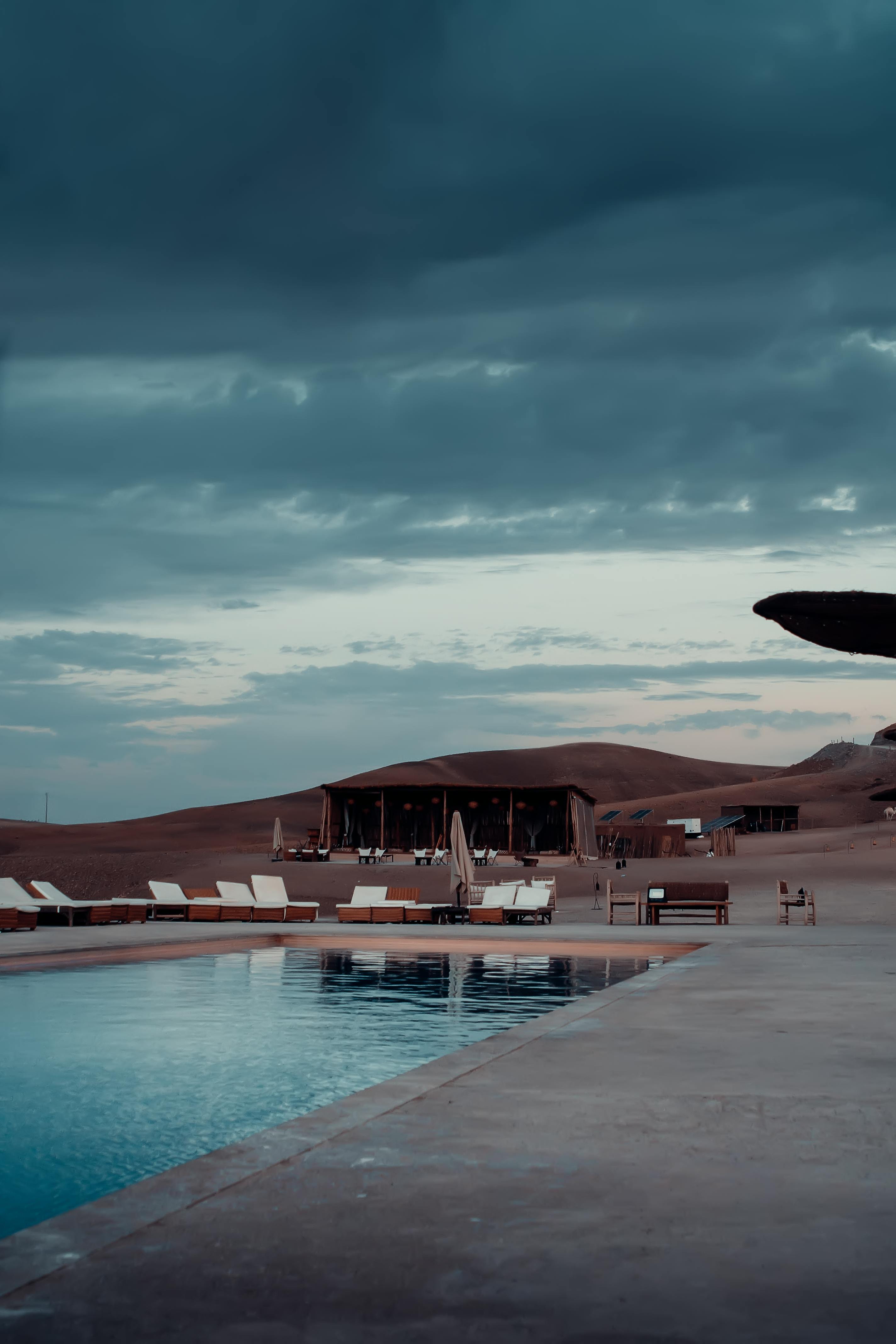 Desert camp and pool at dusk
