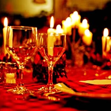 Candlelit dinner table set for a romantic evening