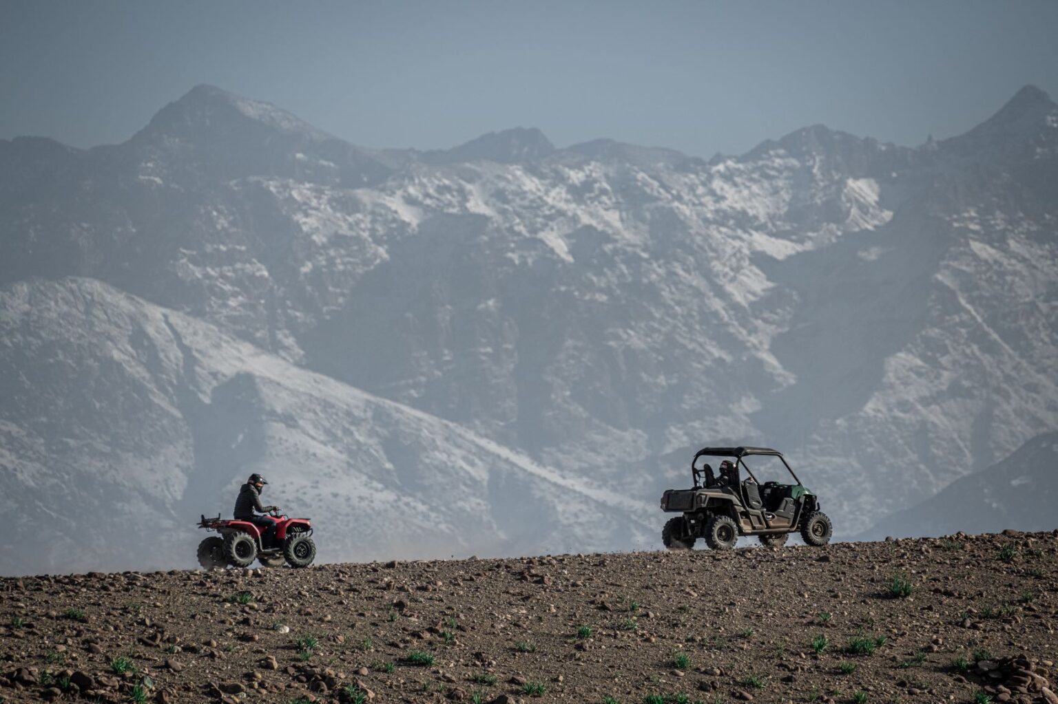 Quad riders with the Atlas Mountains in the background